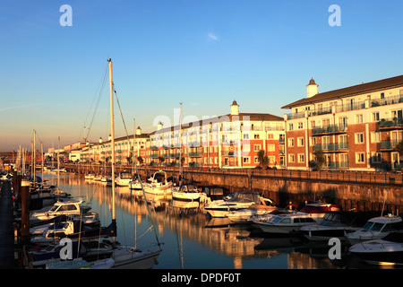 Dawn, boats and houses in Brighton Marina, Brighton & Hove, Sussex County, England, UK Stock Photo