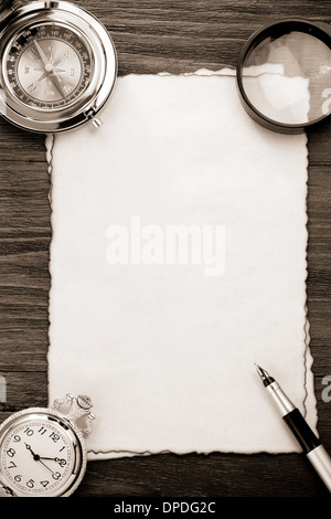 ink pen and compass on parchment background texture Stock Photo