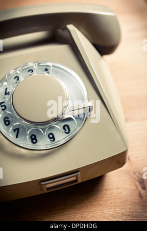 Vintage telephone on old table sepia photo Stock Photo - Alamy