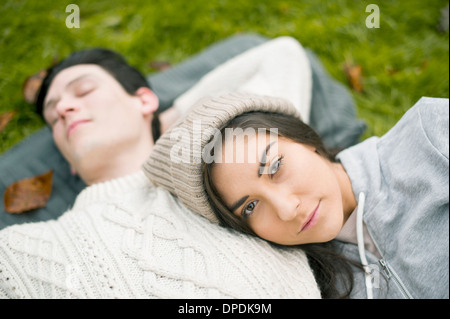 Portrait of young woman resting head on man's chest Stock Photo
