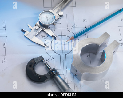 Engineering drawing with product, micrometer and calipers Stock Photo