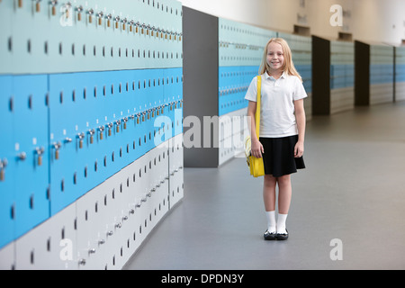Portrait of schoolgirl in corridor Stock Photo