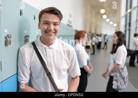 Portrait of teenage schoolboy in corridor Stock Photo
