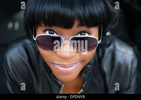 Close up portrait of young woman in sunglasses Stock Photo