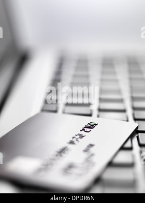 Credit card on laptop to illustrate internet shopping and internet fraud Stock Photo