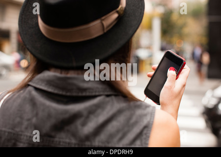 Woman using cellular phone Stock Photo
