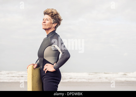 Mature nude woman at the beach Stock Photo - Alamy