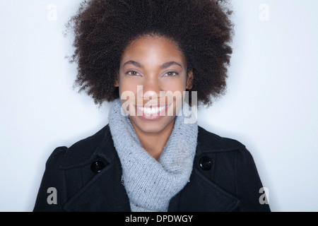 Studio portrait of young woman with afro Stock Photo