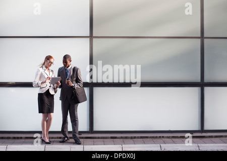 Businesspeople using digital tablet Stock Photo
