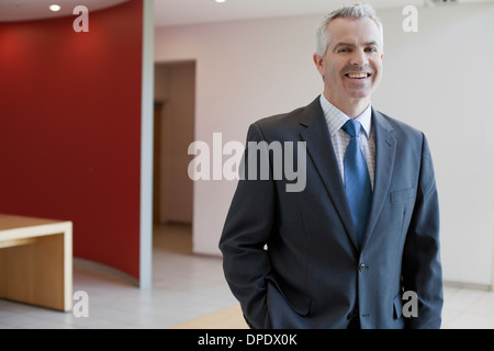 Businessman in waiting area of office Stock Photo