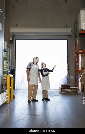 Factory workers in storage warehouse Stock Photo