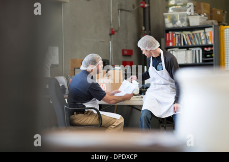 Factory workers in office Stock Photo