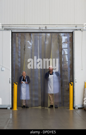 Factory workers by distribution warehouse loading bay Stock Photo