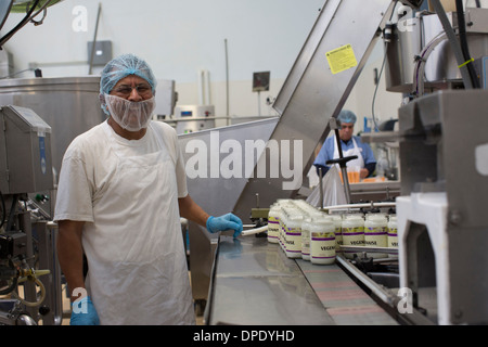 Man working in food production factory Stock Photo