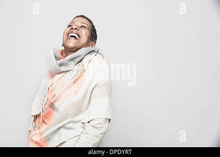 Studio portrait of mature woman laughing Stock Photo