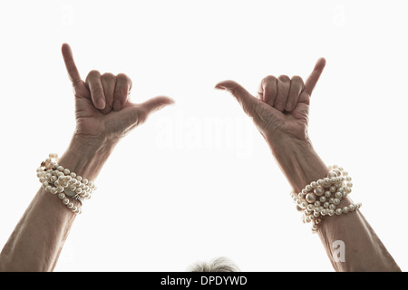 Studio shot of mature woman's gesturing hands Stock Photo