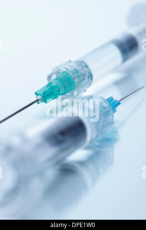 Close up studio shot of two hypodermic needles Stock Photo