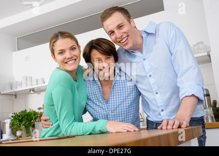 Portrait of youthful grandmother with adult grandchildren Stock Photo