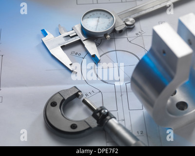 Engineering drawing with product, micrometer and calipers Stock Photo