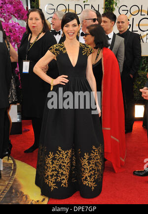 Los Angeles, California, USA. 12th Jan, 2014. 'The Good Wife' actress JULIANNA MARGULIES arrives at the 71st Golden Globe Awards wearing a black and gold Andrew Gn gown and Van Cleef jewels. © D. Long/Globe Photos/ZUMAPRESS.com/Alamy Live News Stock Photo