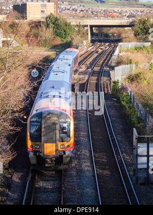 Class 450/0 (Desiro) owned and operated by South West trains crosses Portsbridge creek and enters Portsea island in Portsmouth Stock Photo