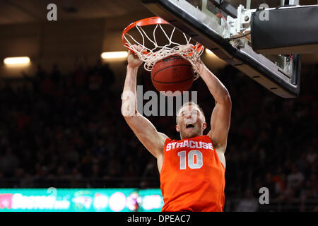 Chestnut Hill, Massachusetts, USA. 13th Jan, 2014. January 13, 2014; Syracuse Orange guard Trevor Cooney (10) dunks during the first half of the NCAA basketball game between the Syracuse Orange and Boston College Eagles at Conte Forum. Syracuse defeated Boston College 69-59. Anthony Nesmith/CSM/Alamy Live News Stock Photo