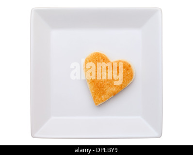 toasted bread with heart shape in plate Stock Photo