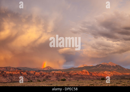 Sunset clouds and rainbow over La Sal Mountains, Utah, Seen from Upper Spanish Valley, Manti-La Sal National Forest Stock Photo