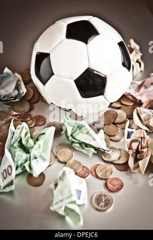 money and soccer ball Stock Photo