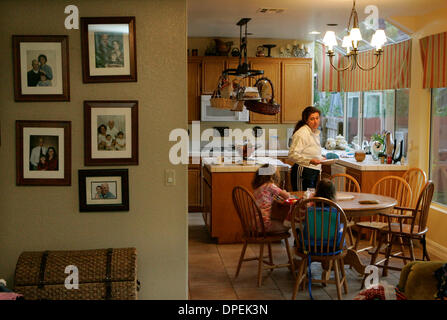(Published 4/25/2006, A-1) April 24, 2006, OCEANSIDE, CA, USA   JANELLE FIELD prepared breakfast for her daughters CATE FIELD, 5, and MEG FIELD, 19 months, left to right, in their Oceanside home, Monday.  Mandatory Credit: photo by Dan Trevan/San Diego Union-Tribune/Zuma Press. copyright 2006 San Diego Union-Tribune Stock Photo