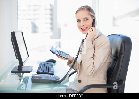 Side view of smiling blonde businesswoman on the phone Stock Photo