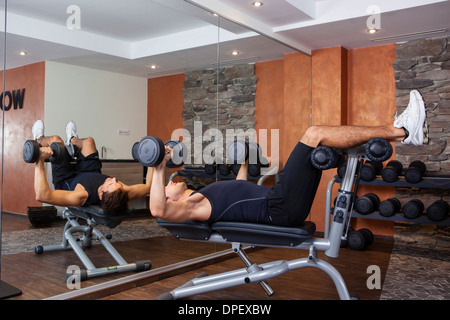 Man doing fitness exercises in a gym Stock Photo