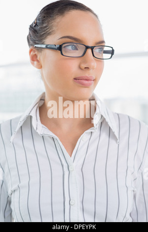 Pretty businesswoman with reading glasses Stock Photo