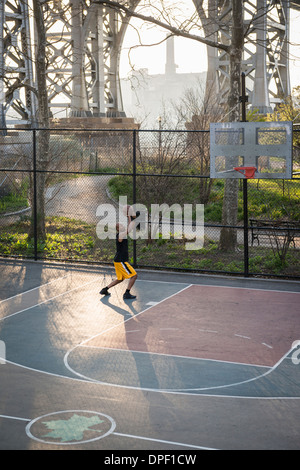 Basketball player shooting Stock Photo