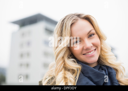 Happy attractive blonde posing outdoors Stock Photo