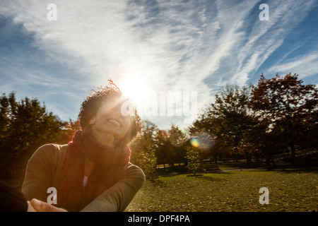 Young woman in park on autumn day Stock Photo