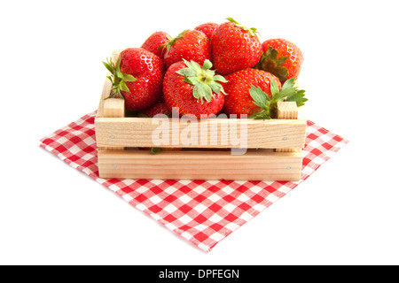 Fresh strawberries in a wooden crate isolated over white Stock Photo