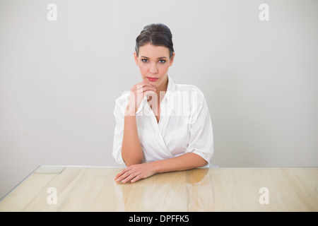 Pensive brunette businesswoman posing Stock Photo
