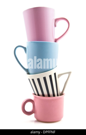 Four colored cups on a pile over white Stock Photo