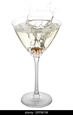 Green Olive splashing into a cocktail glass, isolated on white Stock Photo