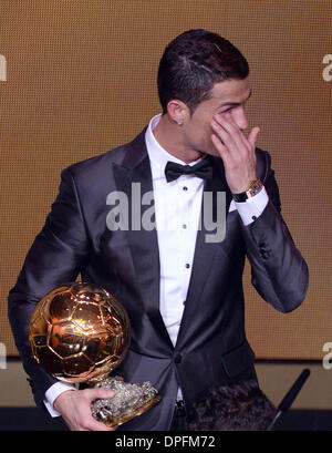 Zurich, Switzerland. 13th Jan, 2014. Portuguese soccer player Cristiano Ronaldo of Real Madrid celebrates with the trophy after being awarded the FIFA Men's World Player of the Year during the FIFA Ballon d'Or Gala 2013 held at the Kongresshaus in Zurich, Switzerland, 13 January 2014. Photo: Patrick Seeger/dpa/Alamy Live News Stock Photo