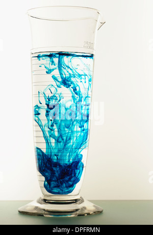Laboratory glassware with liquid on white background. glass chemical ...
