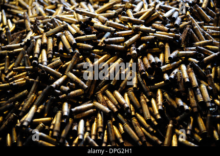 pile of 7.62mm empty bluet casses,, bullets ,bomb, rockets,missiles, shells ,ammo boxes, rounds,he explosive, British army, Stock Photo