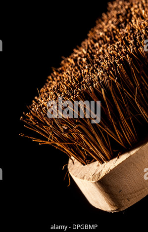 Scrubbing brush - closeup studio shot on a black background. Stock Photo