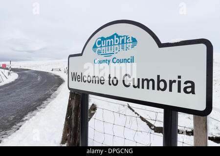 The County Durham and Cumbria border on the B6277 road at Yad Moss in Upper Teesdale England UK. 14th Jan, 2014.  After heavy snowfall there are concerns that as warmer weather and rain arrives this snow will melt and add to rivers already swollen by recent heavy rains. Credit:  David Forster/Alamy Live News Stock Photo