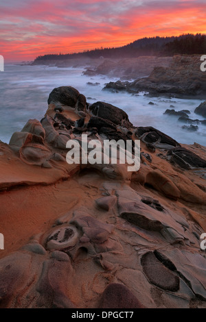 The dramatic Oregon coast line at sunrise along Shore Acres State Park and Cape Arago. USA Stock Photo