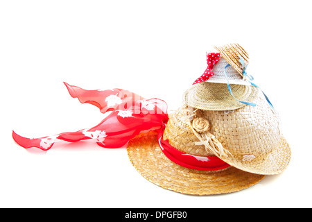 Different kind of straw hats on a stack over white Stock Photo