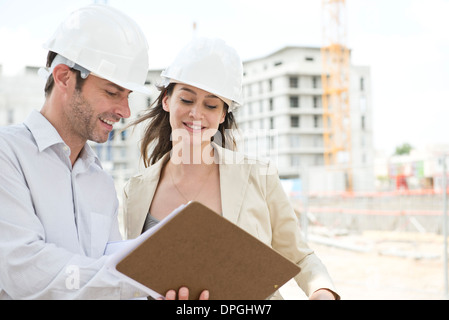 Engineers together at construction site Stock Photo