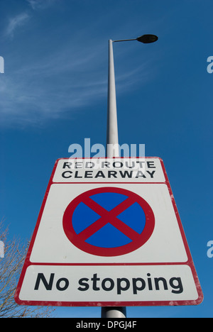 british road sign indicating a red route clearway with no stopping allowed Stock Photo