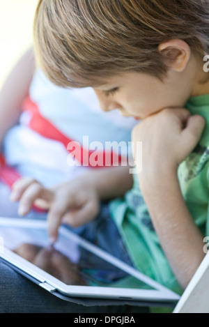 Boy using digital tablet Stock Photo